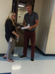 Amanda, 10th grade ELA teacher, and Jacob, 9th grade ELA teacher, discuss a student's essay.